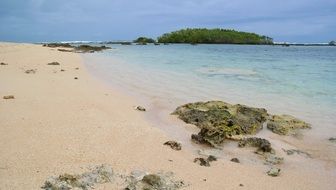 tropical beach on a cloudy day