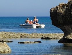 family on a catamaran off the coast of Cyprus