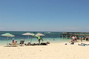 having a rest on a sandy beach by the water