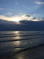 gray thunderclouds over the ocean at sunset