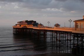 sunset over the pier in cromer