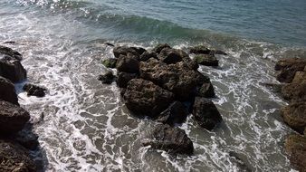 rock formations during the surf in the water