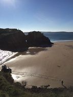 glossy sand Beach at sea in sunshine