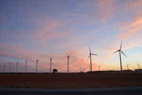 windmills stand along the road