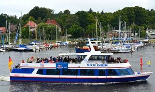 blue pleasure boat off the Baltic coast