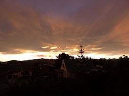 rays of the sun over the city at sunrise