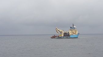 distant view of an industrial ship at sea