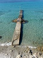 dock in the clear blue water