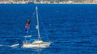 sailboat with several flags