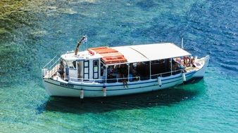 touristic boat in the blue water