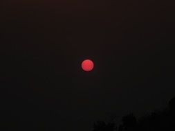 red sun in the dark sky