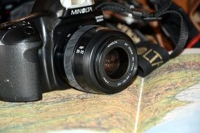 Black camera on a map