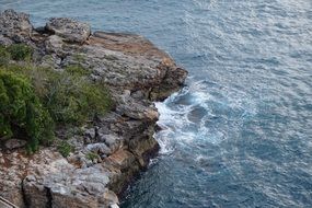 surf on rocky ocean coast