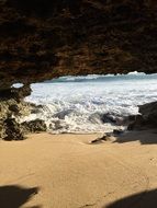 foamy surf off the rocky coast