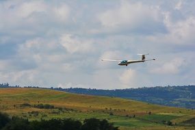 light aircraft over a picturesque landscape