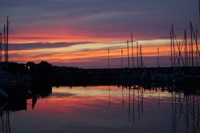 sailboats on the lake at dusk