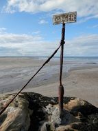 danger sign on the beach