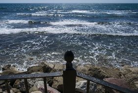 waves near the promenade on a sunny day
