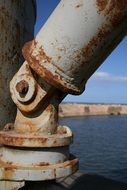 rusty metal pipe in port