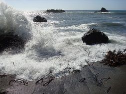 splashes of waves on the shore rocks
