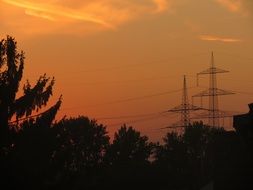 transmission pylons at sunset