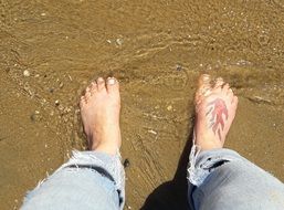 a tattoo on his leg which is in the sea