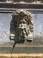 stone sculpture with fountain in spain