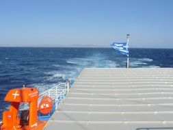 Sea Beach with the flag of Greece