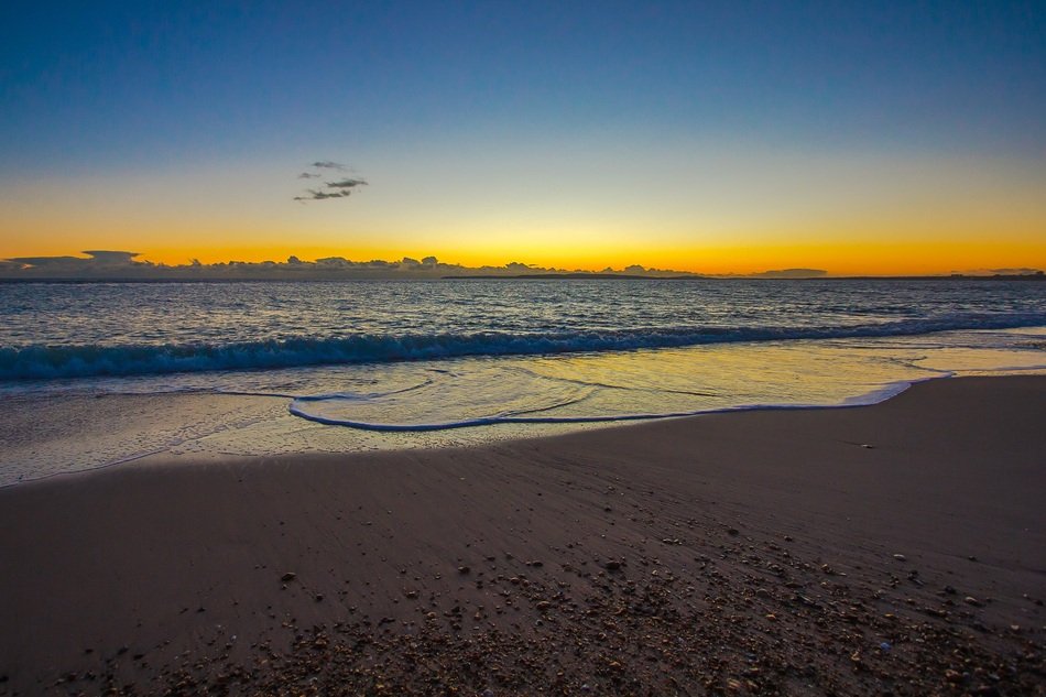 Beautiful landscape with the beach under the sunset in England