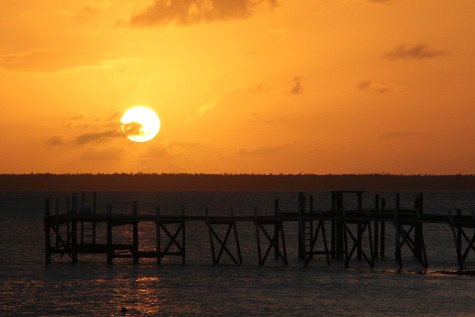 sunset over the pier in bahamas