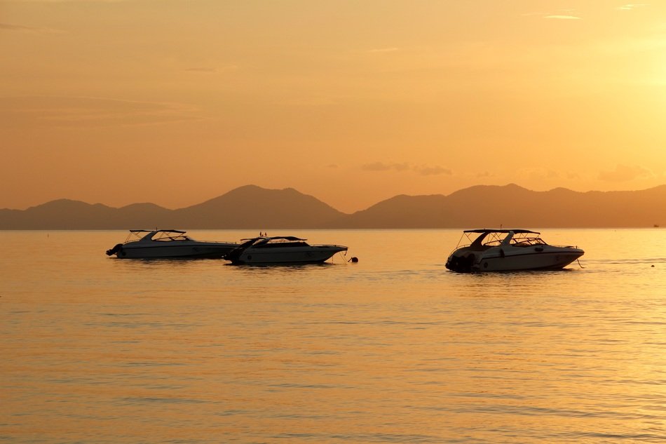 boats at dusk off the coast of mallorca