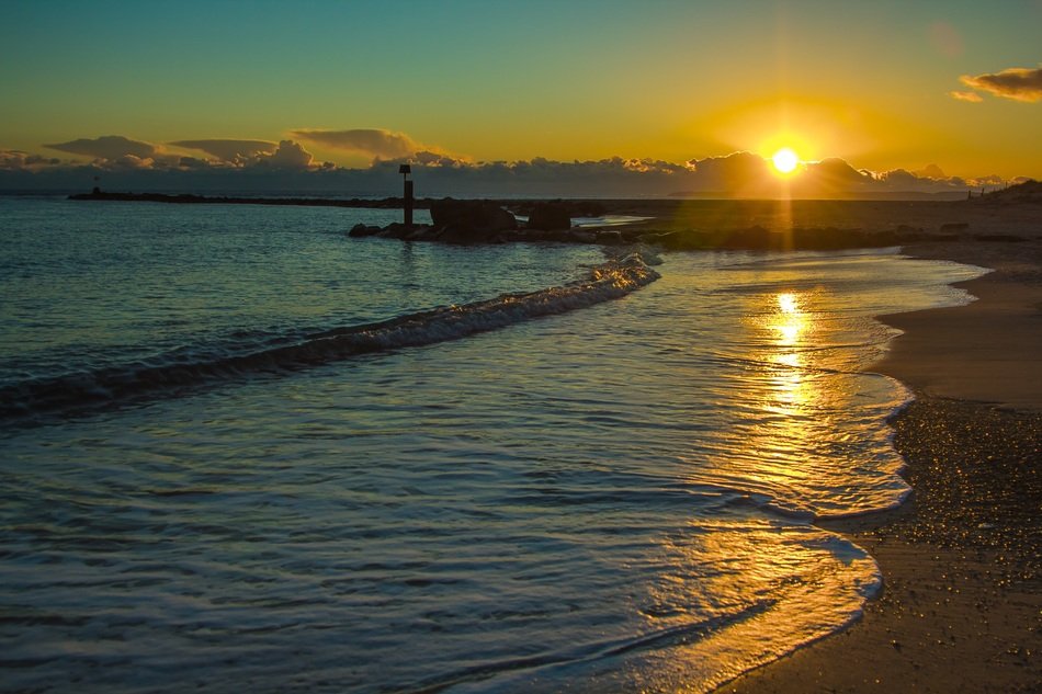 sunset on the background of the sea coast
