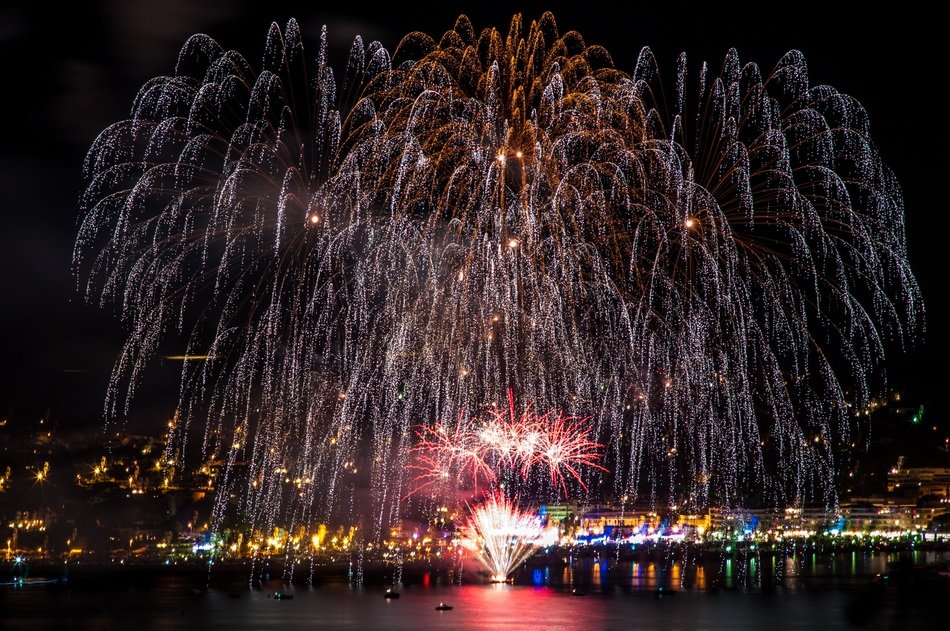 colorful fireworks over the city embankment