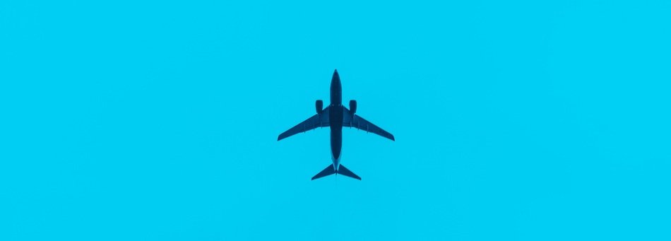 airplane in the sky on a turquoise background