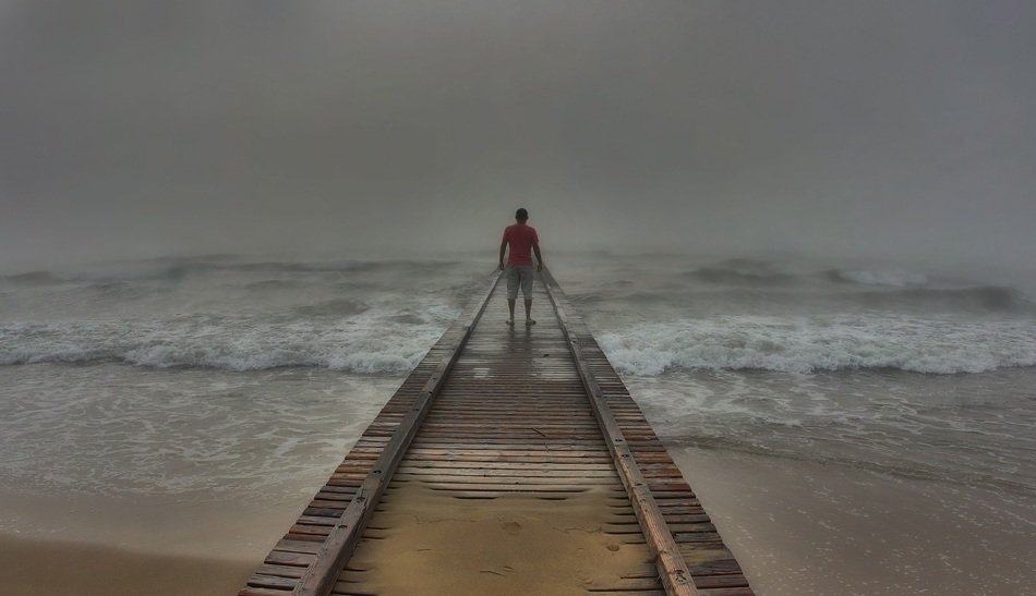 man on the pier in a mystical landscape