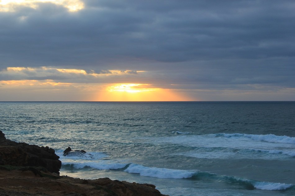 sunset over the coast in cascais