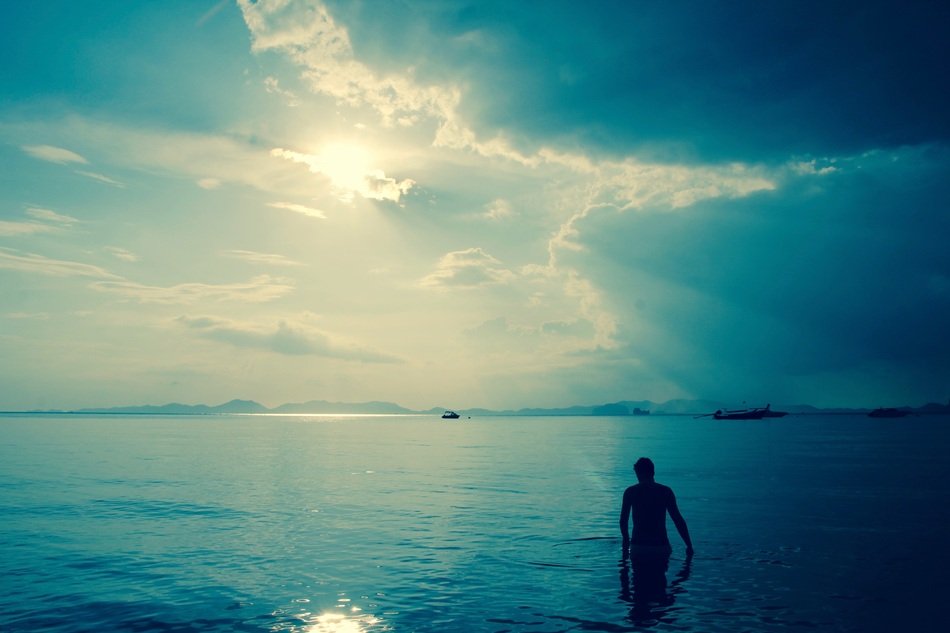 man on near the ocean in the evening