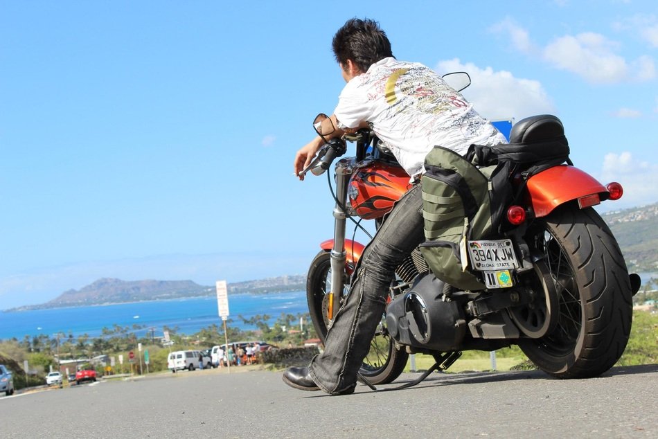 motorcyclist on the road in sunny hawaii