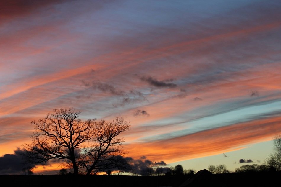 orange stripes of clouds in the night sky