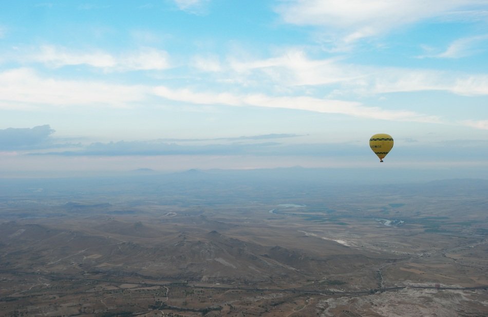 balloon over scenic cappadocia