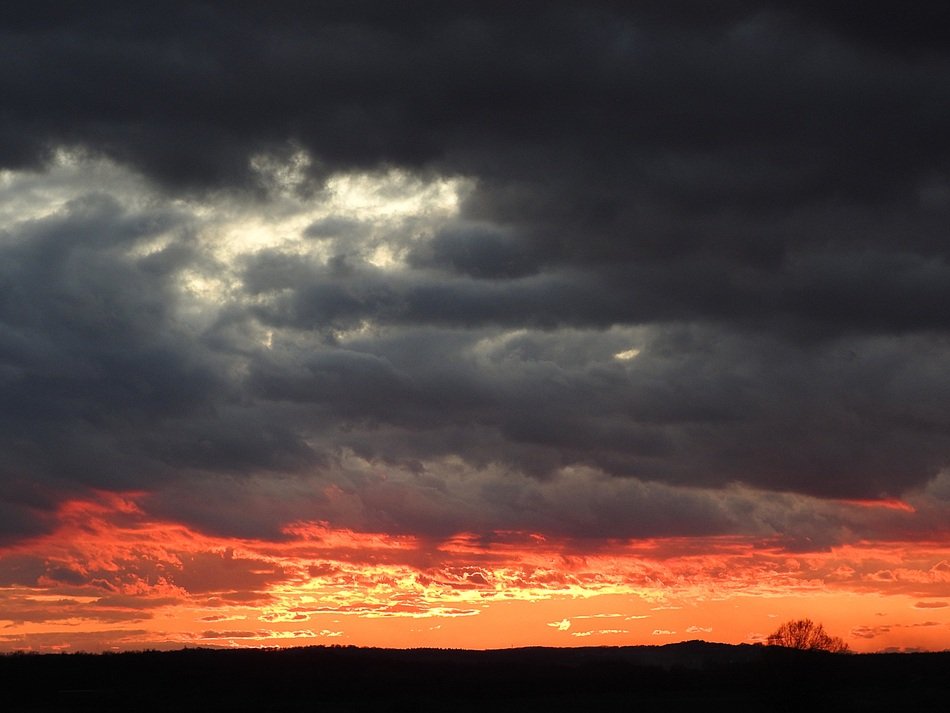 red glow in the gray clouds