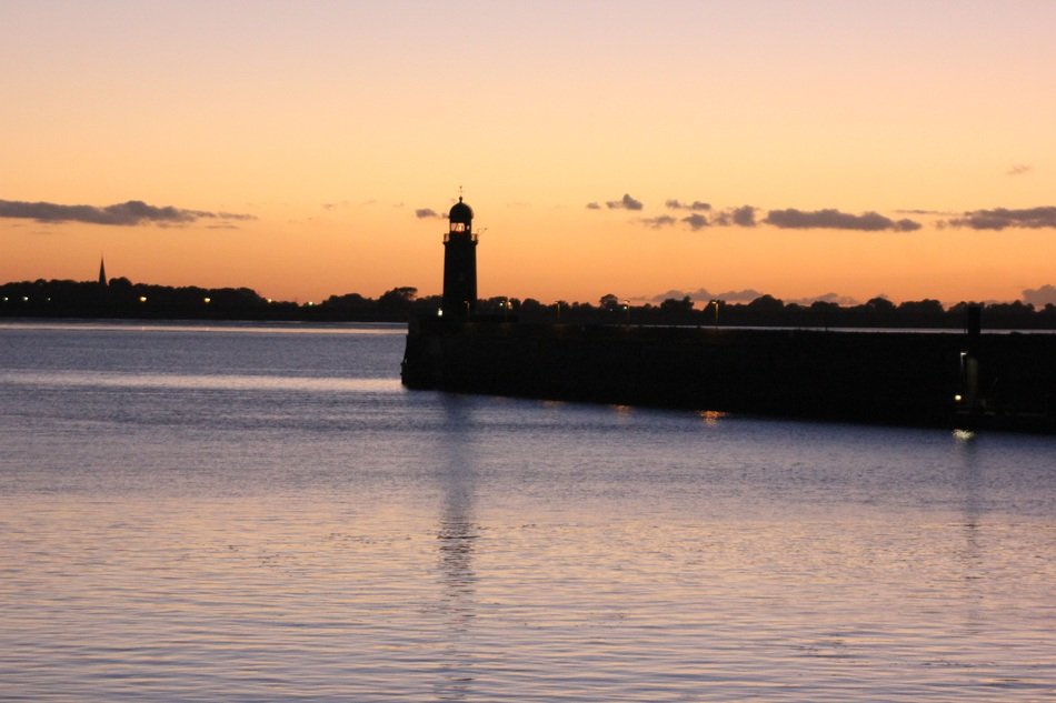 silhouettes of lighthouse at sunset in bremerhaven
