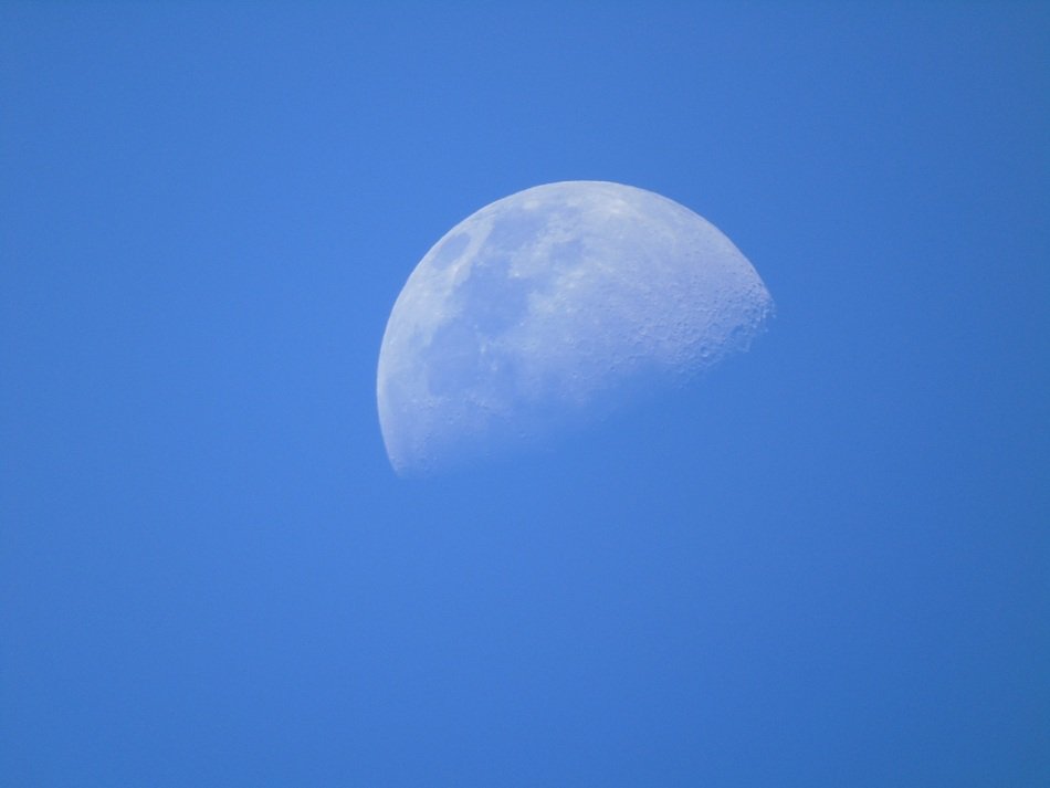 Beautiful white Moon in the beautiful blue sky