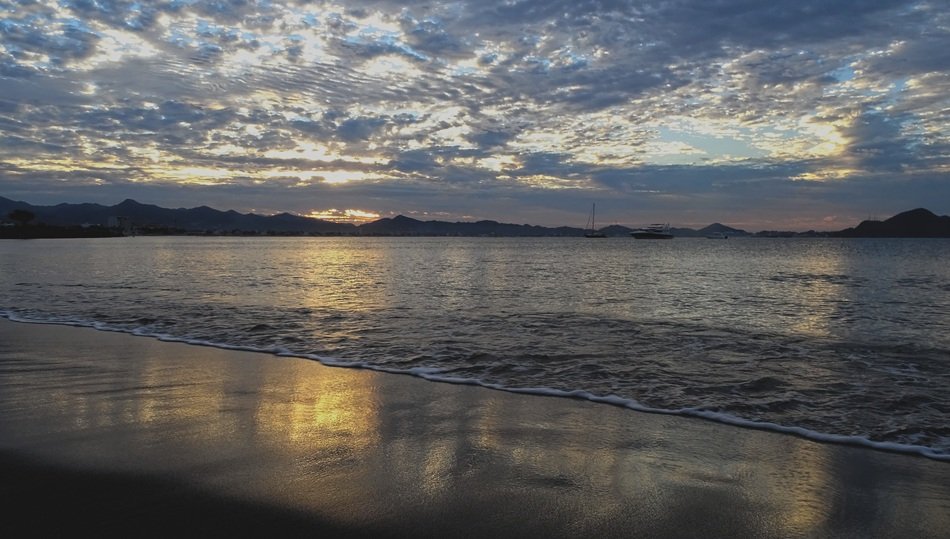 rugged clouds above Sea Beach at sunset