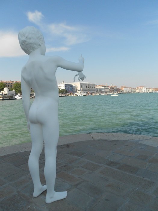 sculpture of man ashore in venice