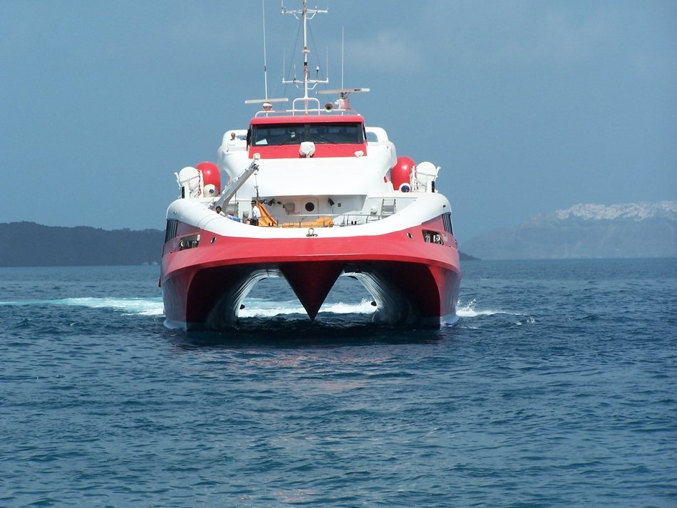 red and white Supercat Boot on sea at coast, greece, Santorini