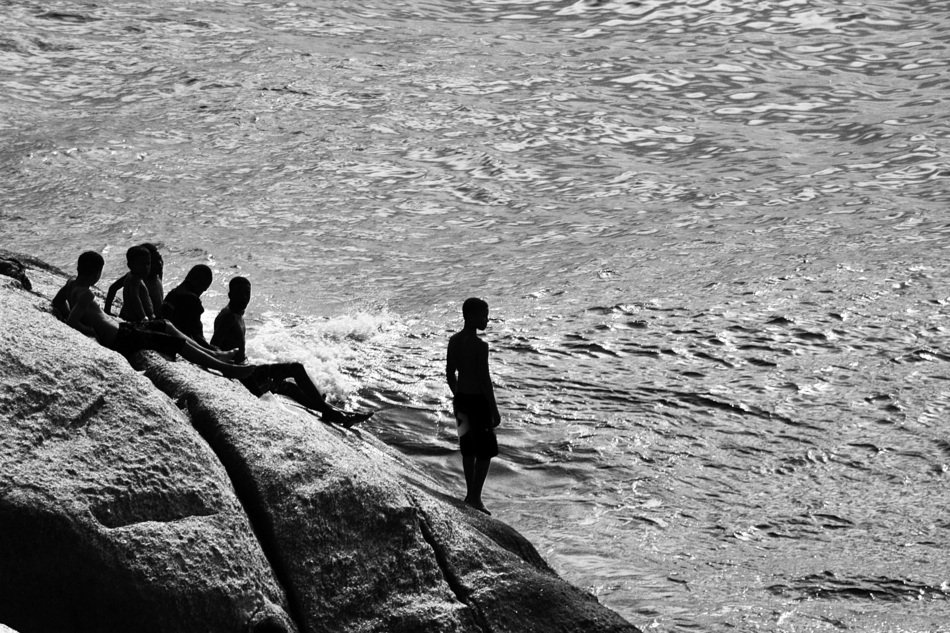 black-and-white photo of people on the beach in Rio de Janeiro