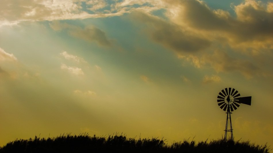windmill on the field at dusk