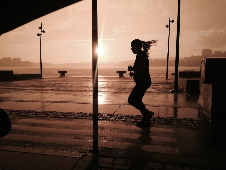silhouette of a running girl in a storm