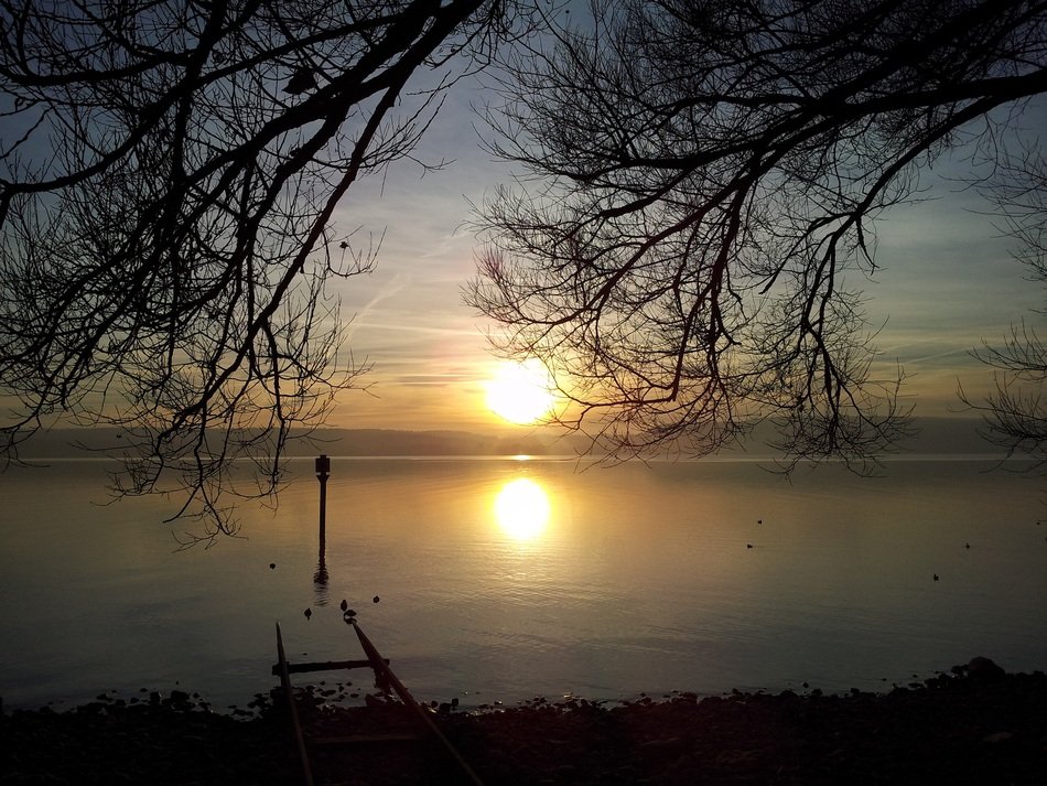 bright sunset over lake constance